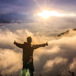 man facing clouds during golden time