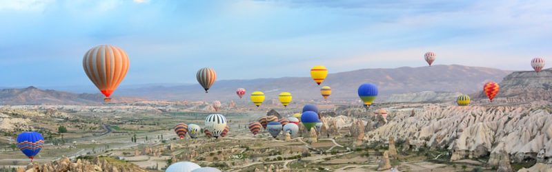 photo of assorted-color air balloon lot in mid air during daytime