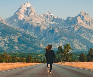 woman walking on road during daytime