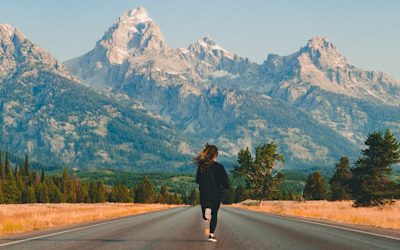 woman walking on road during daytime