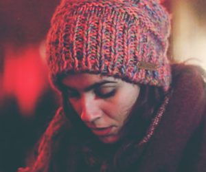 woman surrounded by people in city